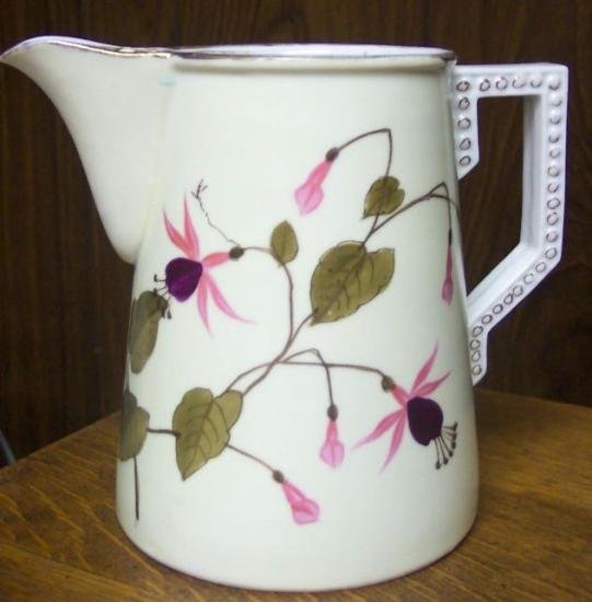 F24-a.Decorative serving pitcher 30kB.jpg (38276 bytes)